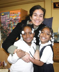 Elizabeth Seebeck with two Montessori students